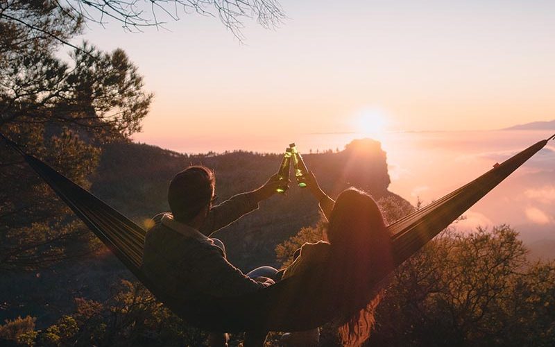 a-beautiful-couple-seated-in-a-hammock-toasting-wi-2021-04-04-08-36-29-utc-copy.jpg